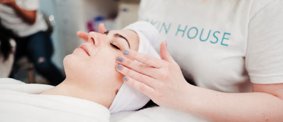 Esthetician performing a Reset Facial